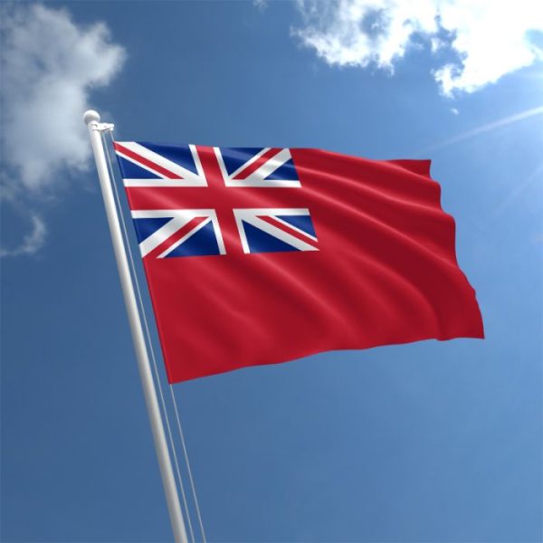 Red Ensign flag flapping with a blue sky behind
